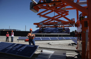 Rover, a robot, placing a solar panel in a track at Alion Energy, which is looking to shave labor costs. Photo: Jim Wilon (The New York Times) Source: www.nytimes.com