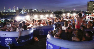 People sit in hot tubs at a Hot Tub cinema event on a warehouse roof in Hackney, east London September 6, 2012. Photo: REUTERS / Olivia Harris Source: www.gothamist.com
